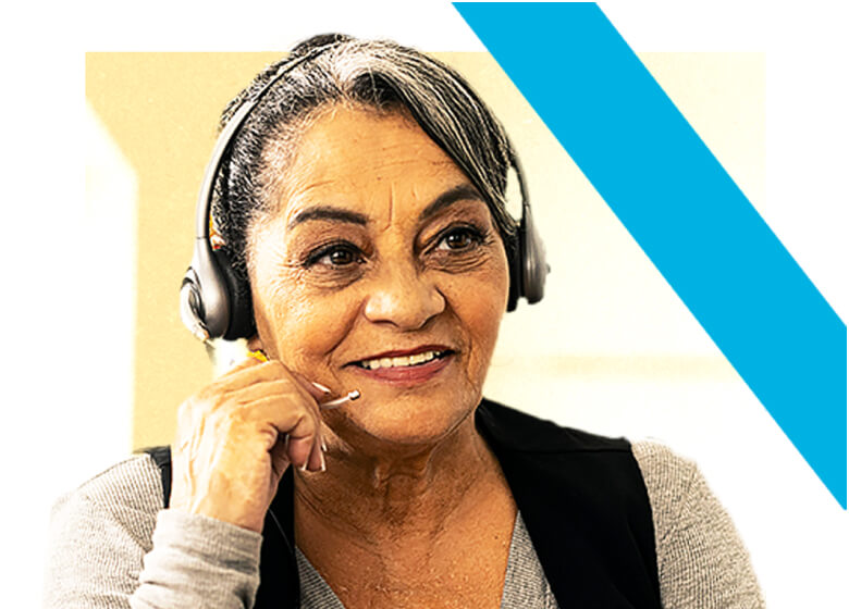 Woman, wearing a headset, holding a box of nictorine patches.